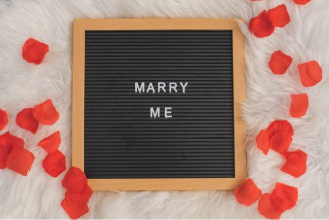 Marriage Proposal with Pegboard and Rose Petals